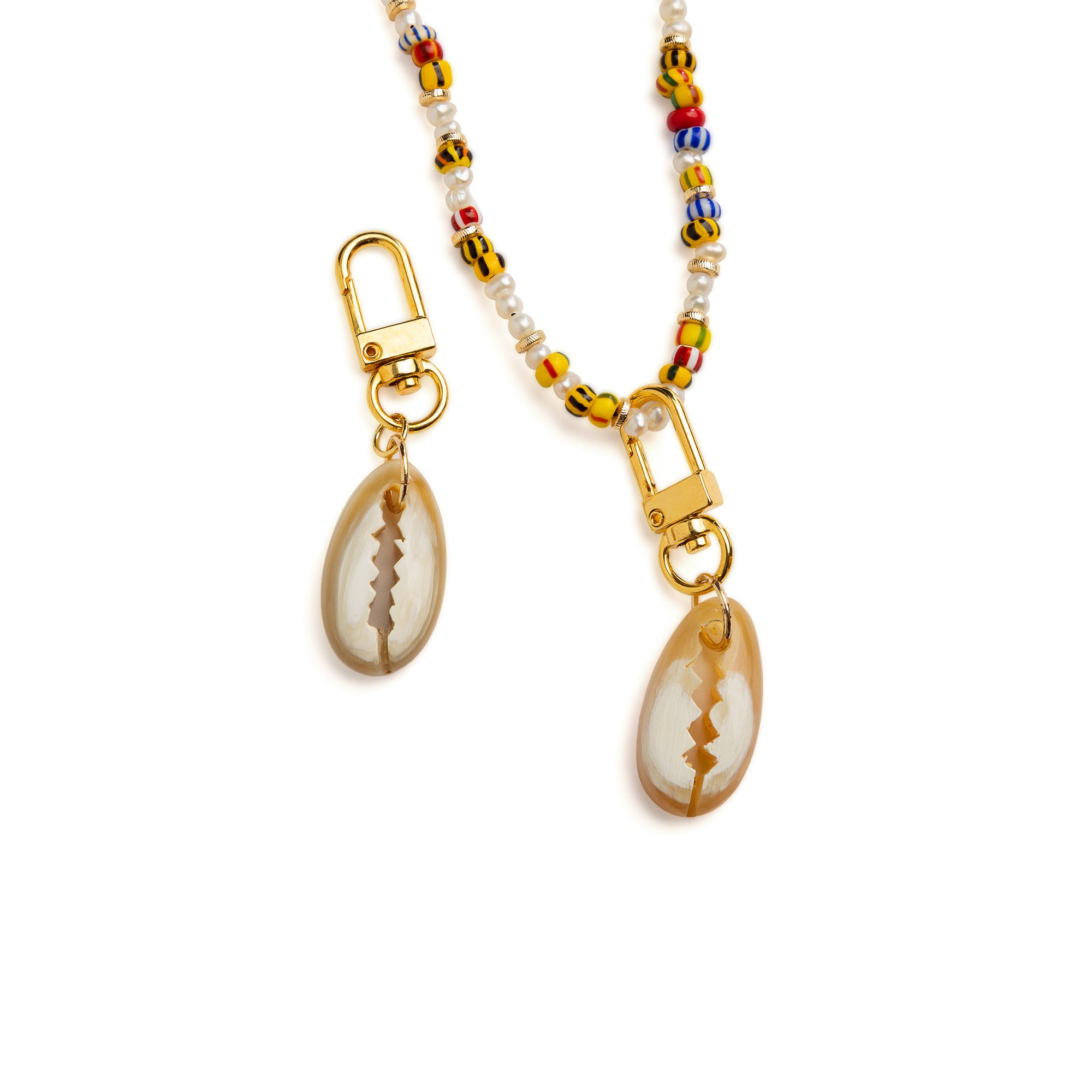 Akola hand-carved cowrie horn charm, side angle