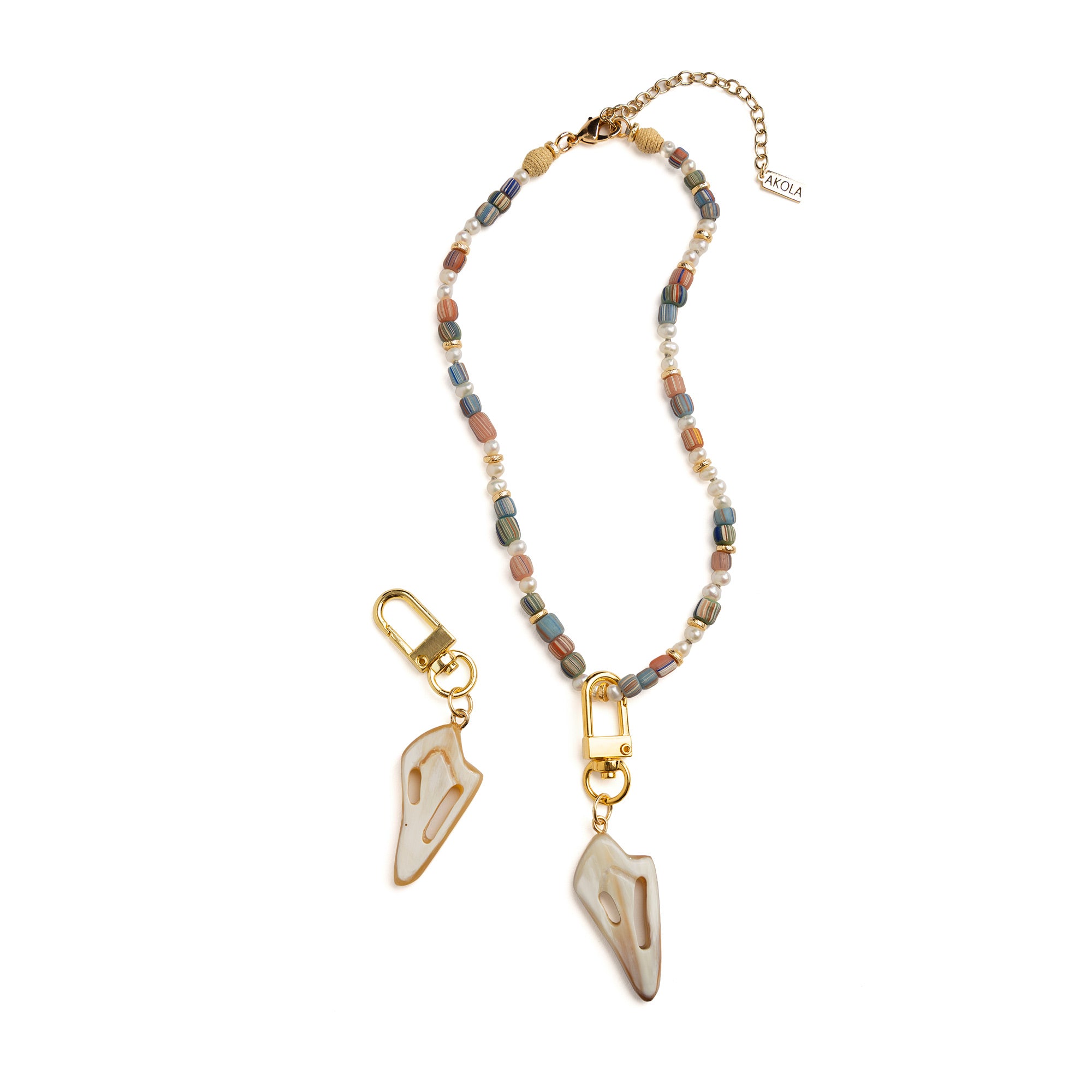 Side view of Akola cut conch shell horn charm