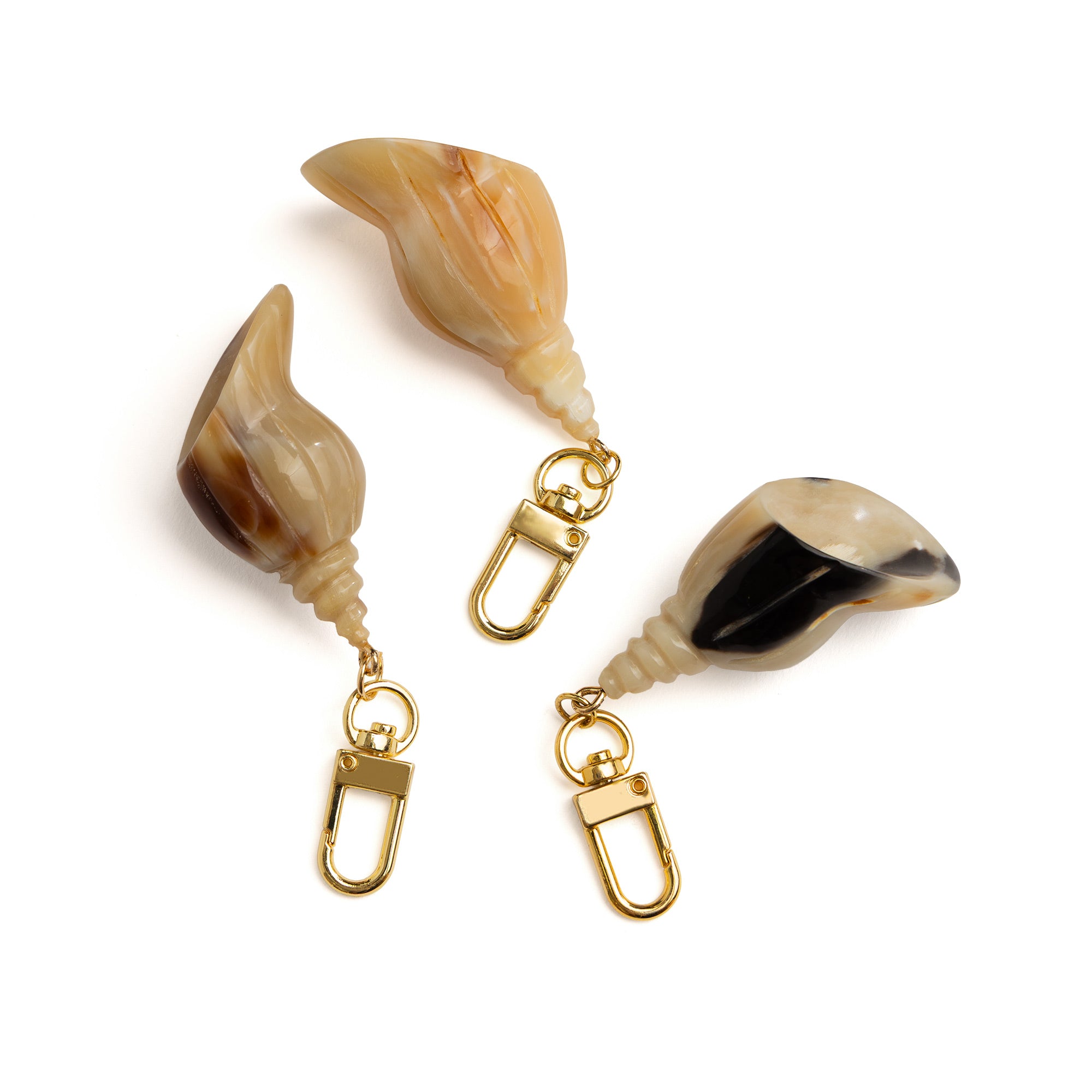 Side view of Akola conch shell horn charm