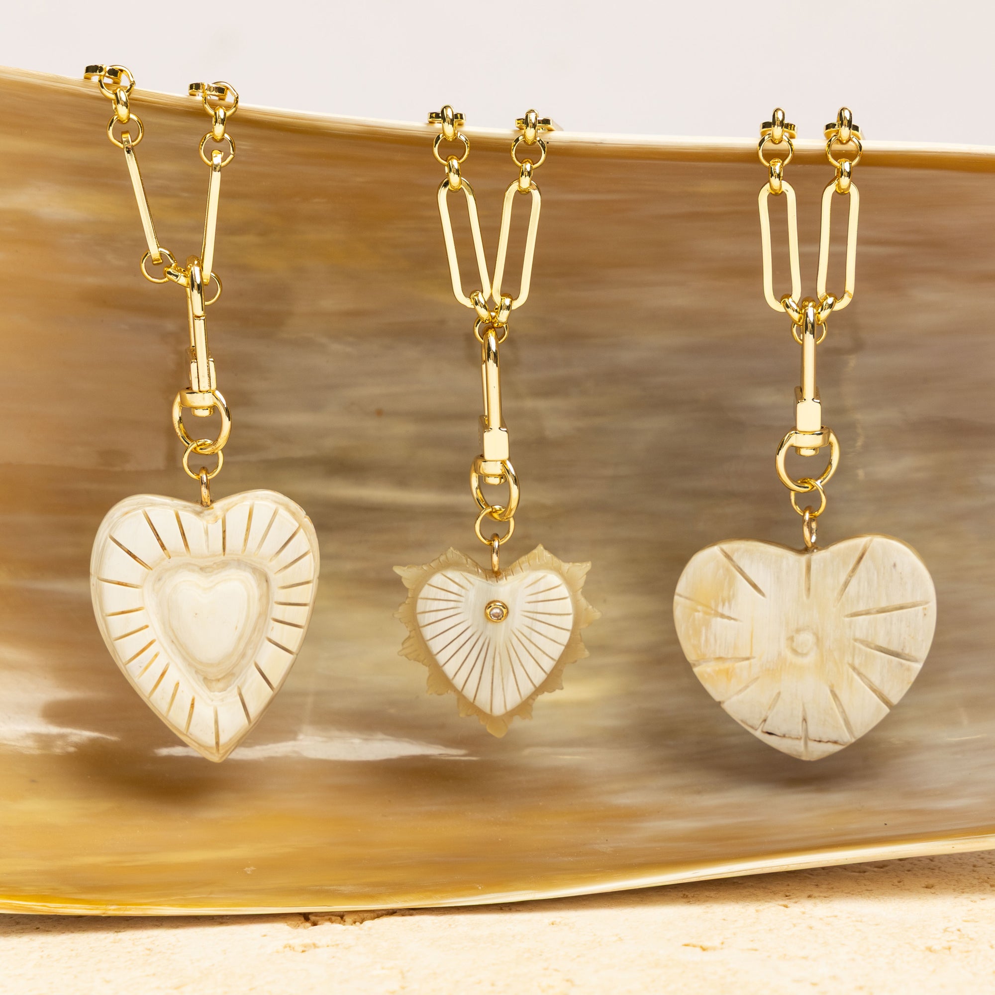 Akola Lucia heart charm hand-carved from horn with gold-plated clasp