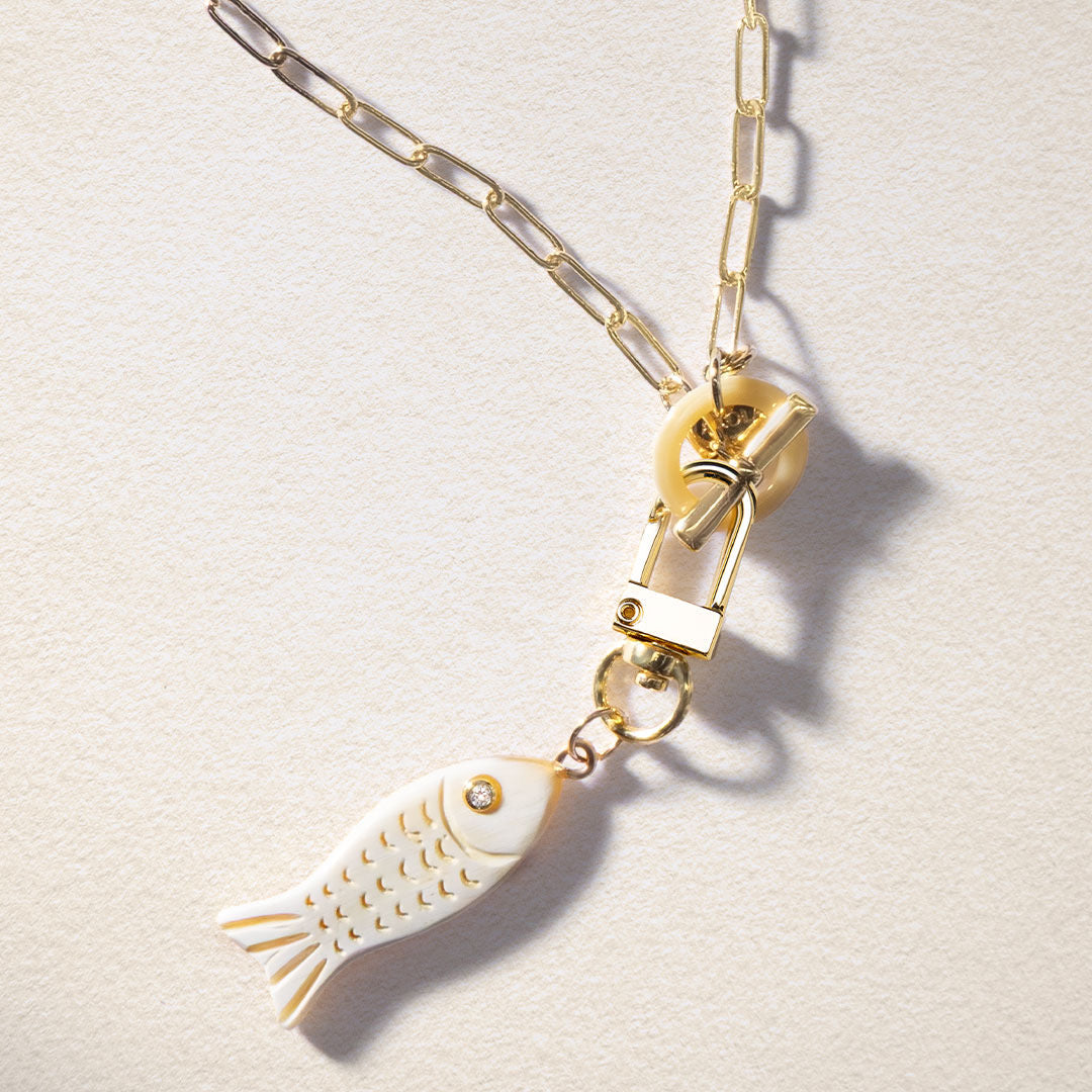 Lilly Sisto x Akola fish charm in hand-carved horn