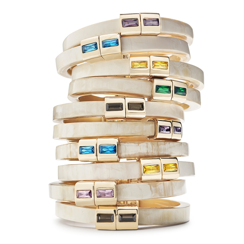 A stack of unlock-it bracelets on a white background