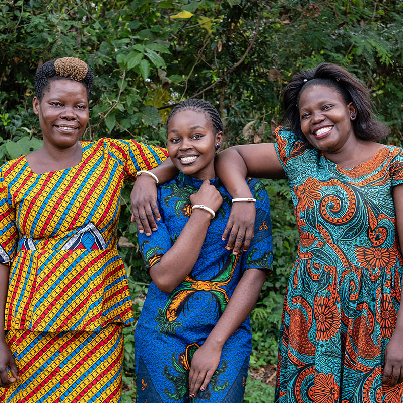 Three women in Uganda. Akola employees