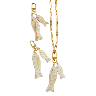 Side view of Lilly Sisto x Akola double fish charm in Ankole horn