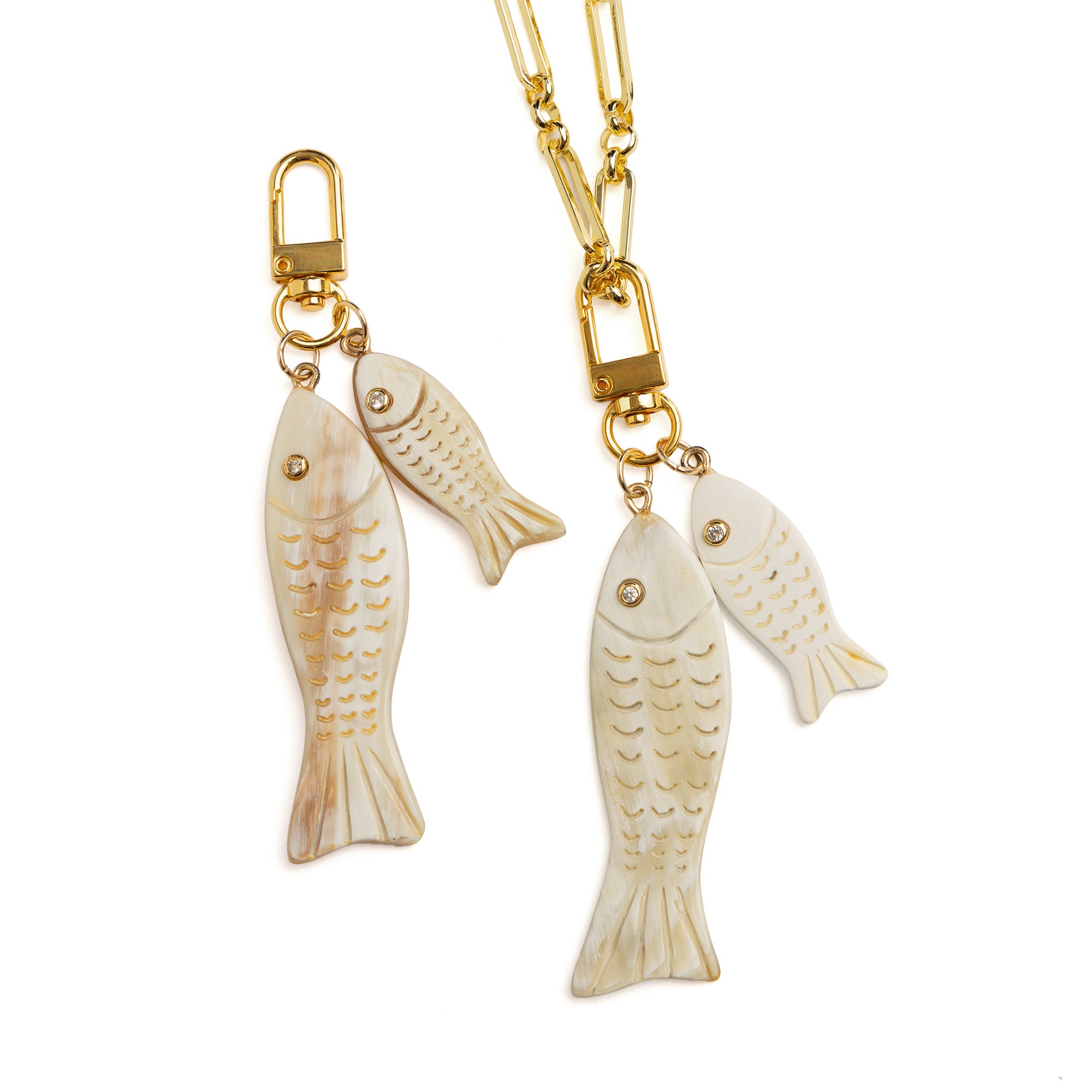 Akola double fish charm in hand-carved horn with 18k gold-plated clasp