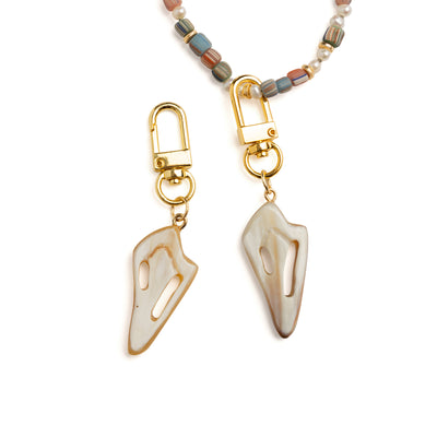 Lilly Sisto x Akola cut conch charm in hand-carved Ankole horn