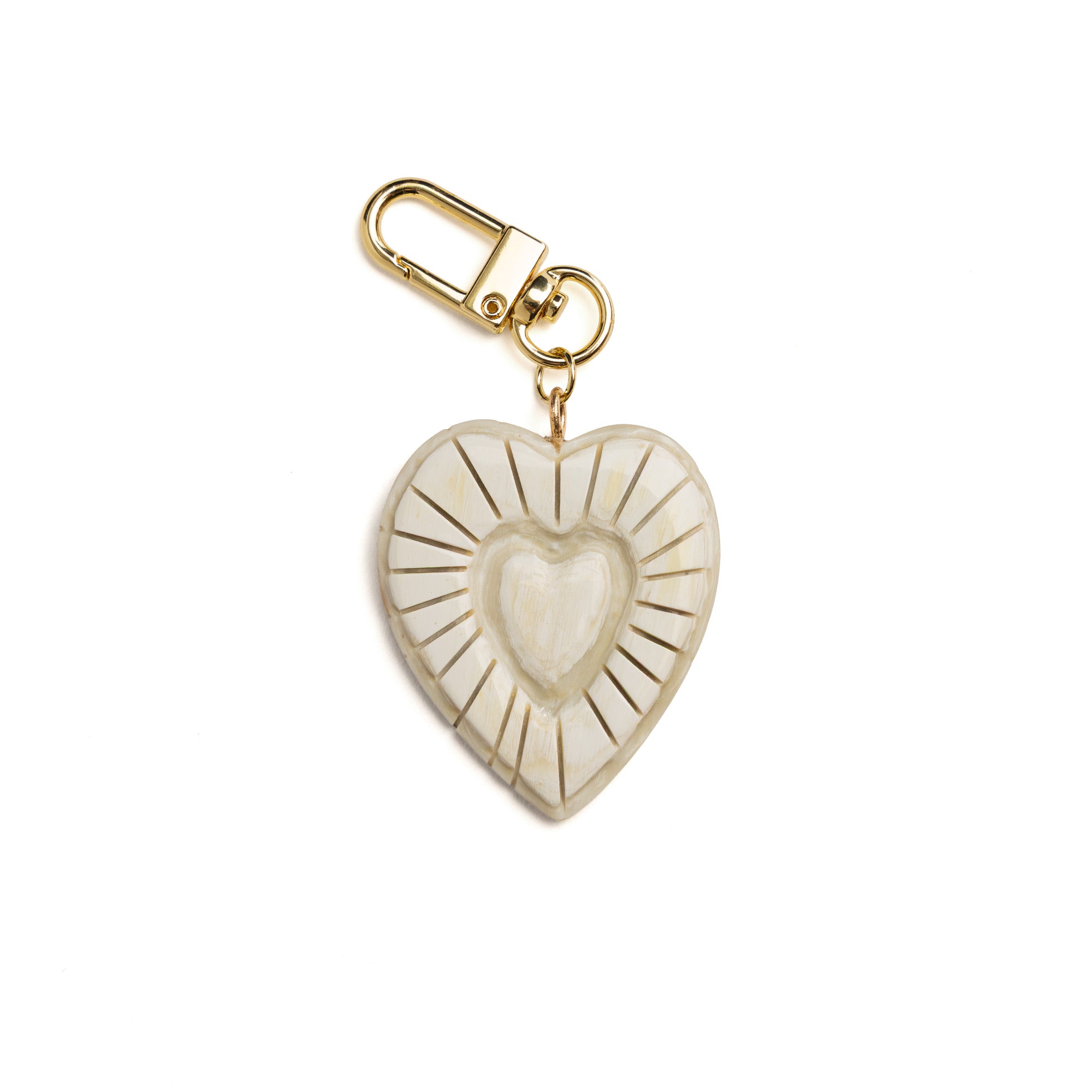 Heart-shaped keychain with gold accents on a white background