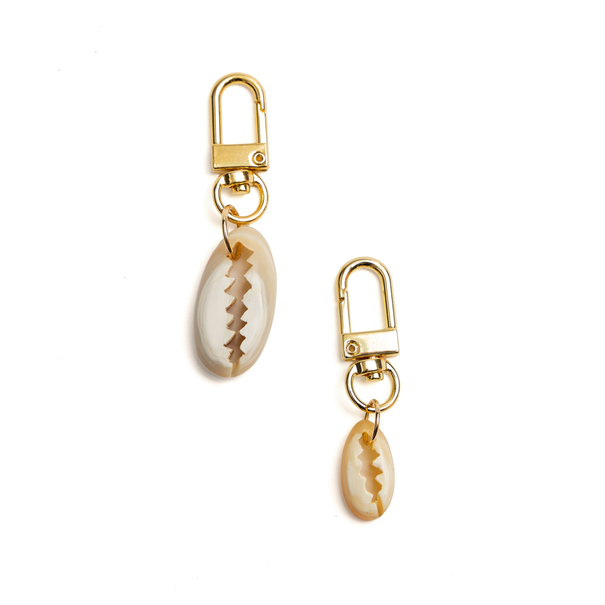Detail of Akola hand-carved cowrie shell horn charm