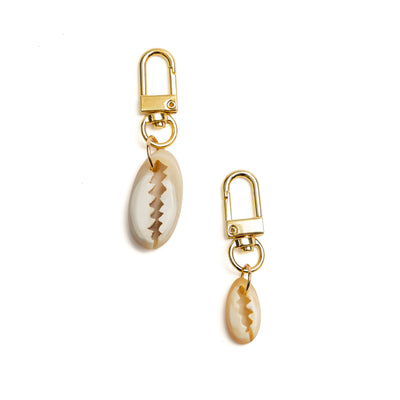 Detail of Akola hand-carved cowrie shell horn charm