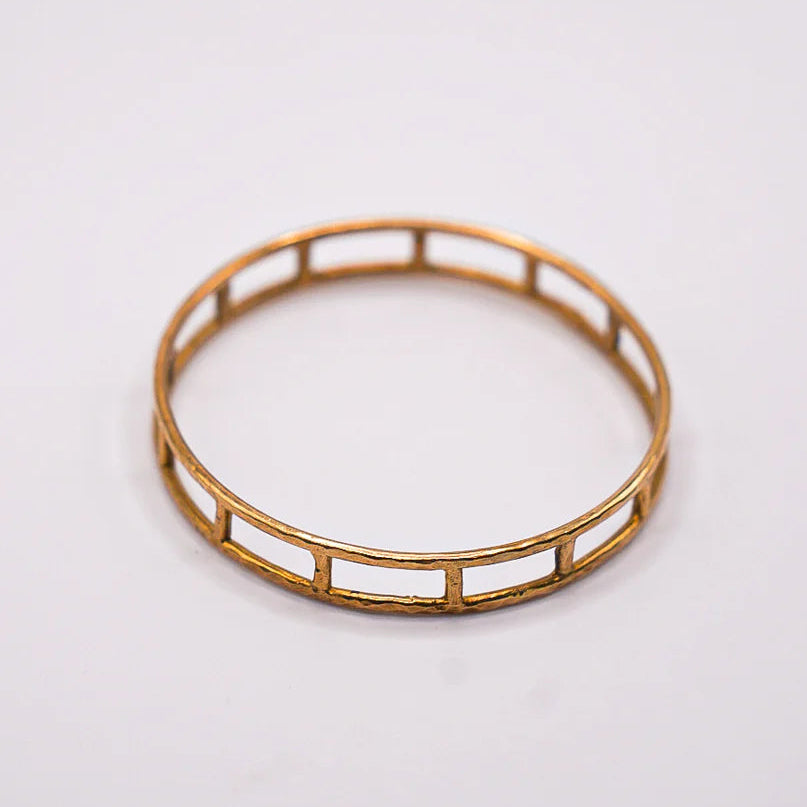 Akola Cage brass bangle hand-cast from recycled brass in Uganda