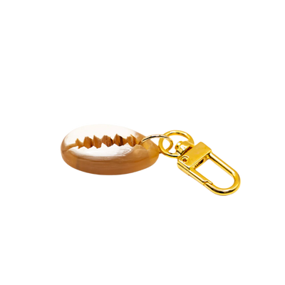 Akola cowrie horn charm styled view